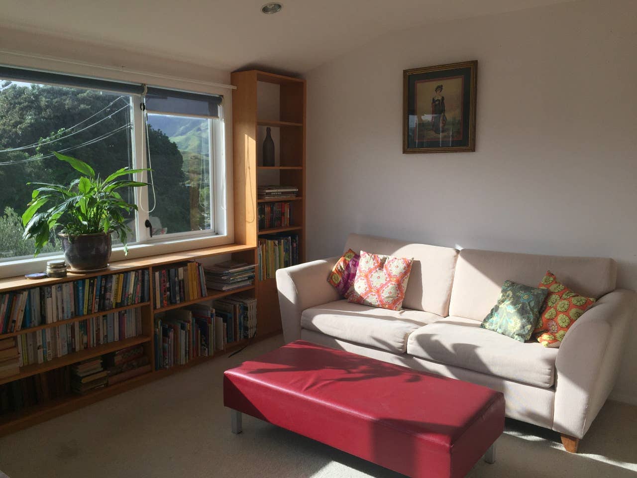 Warm sunny living room, with kitchenettte.